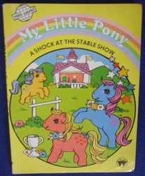 Size: 823x1000 | Tagged: safe, derpibooru import, applejack (g1), bubbles (g1), earth pony, pony, g1, a shock at the stable show, book, book cover, bow, cover, female, flower, mare, official, tail, tail bow, trophy