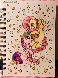 Size: 2252x2996 | Tagged: safe, artist:dariarchangel, derpibooru import, fluttershy, fluttershy (g3), earth pony, pegasus, pony, g3, g4, braid, braided tail, duo, female, floral head wreath, flower, flying, g3 to g4, generation leap, generational ponidox, looking at each other, looking at someone, photo, sitting, smiling, smiling at each other, spread wings, tail, traditional art, wings