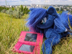 Size: 4656x3492 | Tagged: safe, derpibooru import, princess luna, alicorn, female, grass, irl, mare, nintendo dsi, photo, photographer needed, plushie, solo