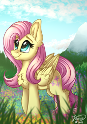 Size: 2894x4093 | Tagged: safe, artist:julunis14, derpibooru import, fluttershy, pegasus, pony, g4, chest fluff, cloud, cute, ear fluff, ears, female, flower, folded wings, grass, high res, leg fluff, looking up, mare, mountain, outdoors, redraw, shyabetes, signature, sky, smiling, solo, wings