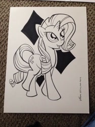 Size: 768x1024 | Tagged: safe, artist:thom zahler, derpibooru import, rarity, pony, unicorn, g4, 2014, black and white, commission, female, grayscale, heroescon, heroescon 2014, horn, looking up, mare, monochrome, open mouth, open smile, photo, raised leg, signature, smiling, solo, tail, traditional art
