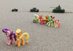 Size: 1064x751 | Tagged: safe, artist:dingopatagonico, derpibooru import, apple bloom, apple fritter, applejack, big macintosh, granny smith, sugar belle, earth pony, unicorn, apple family, apple family member, horn, jeep, m4 sherman, photo, tank (vehicle), toy