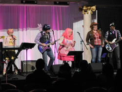 Size: 1024x768 | Tagged: safe, artist:brinycosplay, artist:the shake ups, derpibooru import, applejack, fluttershy, pinkie pie, twilight sparkle, human, g4, clothes, cosplay, costume, electric guitar, guitar, irl, irl human, musical instrument, photo, ponycon 2016, ponycon nyc