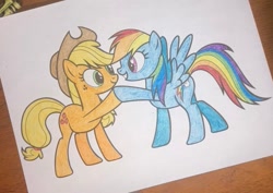 Size: 911x645 | Tagged: safe, artist:lullapiies, derpibooru import, applejack, rainbow dash, pony, hoofbump, traditional art