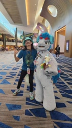 Size: 900x1599 | Tagged: safe, artist:springbear452_, derpibooru import, oc, oc:the living tombstone, earth pony, human, 2023, clothes, cosplay, costume, duo, fursuit, headphones, indoors, irl, irl human, megaplex, photo, ponysuit