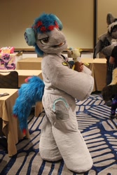 Size: 1365x2048 | Tagged: safe, artist:springbear452_, derpibooru import, oc, oc only, oc:the living tombstone, earth pony, human, 2023, clothes, cosplay, costume, fursuit, headphones, indoors, irl, irl human, megaplex, photo, ponysuit, solo