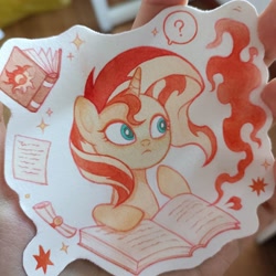 Size: 3072x3072 | Tagged: safe, artist:miss-aciturn, derpibooru import, sunset shimmer, pony, unicorn, g4, badge, book, horn, irl, photo, solo, traditional art