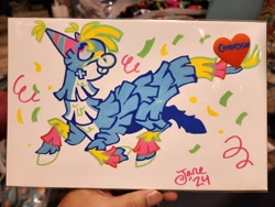 Size: 2048x1536 | Tagged: safe, artist:janegumball, derpibooru import, oc, oc only, oc:bash the piñata, pony, blue body, blue sclera, body markings, bucktooth, cheek fluff, colored hooves, colored sclera, commission, confetti, everfree northwest, everfree northwest 2024, facial markings, freckles, hat, hooves, leg markings, looking up, nonbinary oc, party hat, photo, pink eyes, piñata, piñata pony, posca, prancing, profile, signature, smiling, solo, traditional art, white hooves