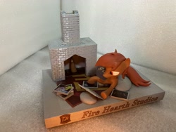 Size: 4032x3024 | Tagged: safe, artist:knightngame, derpibooru import, oc, oc only, earth pony, pony, 3d print, book, figurine, fireplace, irl, photo, solo