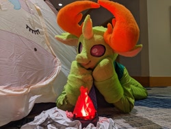 Size: 2048x1536 | Tagged: safe, artist:azuritecoin, artist:limeythecheetah, derpibooru import, thorax, changedling, changeling, bonfire, fire, fursuit, hooves on cheeks, irl, king thorax, lying down, photo, prone, solo, tent