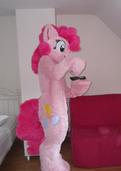 Size: 1138x1608 | Tagged: safe, artist:spainfischer, derpibooru import, pinkie pie, fursuit, hoof hold, indoors, irl, photo, ponysuit, remote control, solo