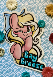 Size: 2532x3614 | Tagged: safe, artist:emberslament, derpibooru import, oc, oc only, oc:bay breeze, pegasus, badge, blushing, bow, cute, hair bow, looking at you, one eye closed, pegasus oc, photo, traditional art, wink, winking at you