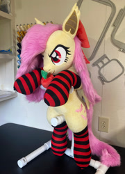 Size: 1714x2384 | Tagged: safe, artist:qtpony, derpibooru import, fluttershy, bat pony, pony, apple, bat ponified, bow, clothes, flutterbat, food, hair bow, irl, photo, plushie, race swap, socks, solo, striped socks