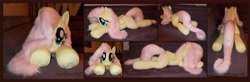 Size: 9048x2984 | Tagged: safe, artist:calusariac, derpibooru import, fluttershy, pegasus, pony, absurd resolution, irl, lying down, photo, plushie, prone, solo, sploot