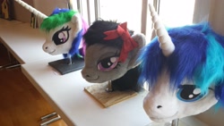 Size: 4128x2322 | Tagged: safe, artist:atalonthedeer, derpibooru import, octavia melody, princess celestia, shining armor, g4, 2013, disembodied head, fursuit head, galacon, irl, photo, ponysuit, table, trio