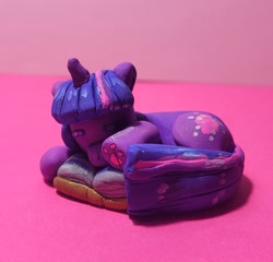 Size: 1731x1659 | Tagged: safe, artist:koidial, derpibooru import, part of a set, twilight sparkle, unicorn twilight, pony, unicorn, g4, bangs, book, bookhorse, clay, colored paw pads, eyes closed, female, horn, irl, lying down, mare, open book, paw pads, paws, paws on pony, photo, polymer clay, prone, purple coat, shiny eyelashes, sleeping, straight mane, straight tail, three quarter view, three toned mane, three toned tail, traditional art, underpaw, unicorn horn