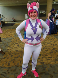 Size: 1024x1366 | Tagged: safe, artist:brinycosplay, derpibooru import, fili-second, pinkie pie, human, g4, 2016, bronycon, bronycon 2016, clothes, cosplay, costume, hand on hip, indoors, irl, irl human, photo, power ponies