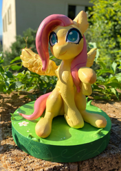 Size: 1748x2480 | Tagged: safe, artist:kuzoux, derpibooru import, fluttershy, pegasus, pony, g4, craft, female, irl, mare, outdoors, photo, sculpture, sitting, solo, spread wings, traditional art, wings, zine:my little fanzine